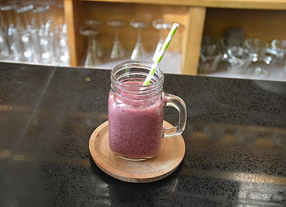 clear glass jar with pink liquid thumbnail