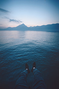 person sitting on seadock thumbnail