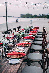 table and chair arrangement on seashore thumbnail