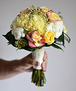 person holding bouquet of flowers thumbnail