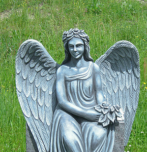 shallow focus photography of angel concrete statue thumbnail