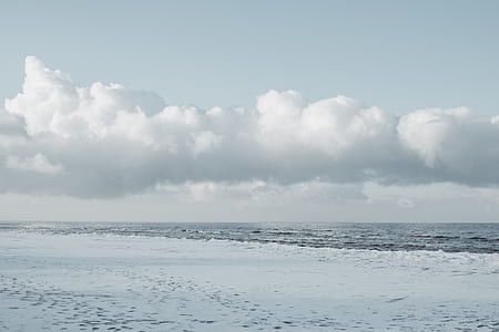 shoreline under cloudy sky thumbnail