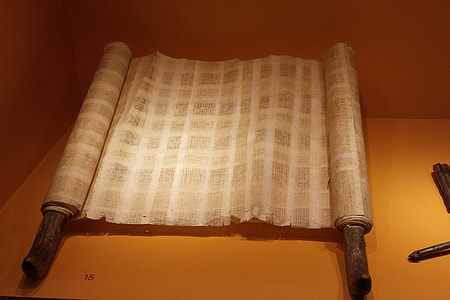 rolled beige paper on orange surface thumbnail