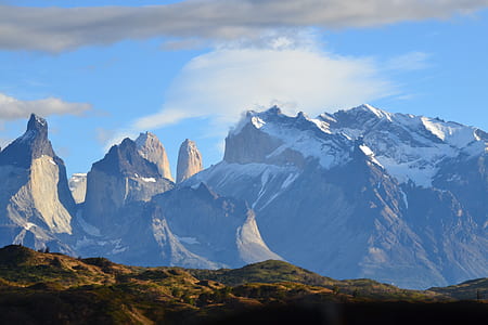 snow covered mountains under white clouds at daytime thumbnail