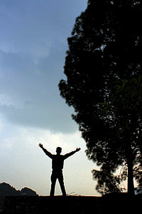 man standing in front of treer thumbnail