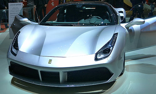 silver Ferrari sports car in show room thumbnail