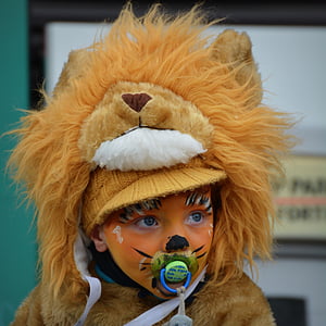 portrait photography of child in lion costume thumbnail