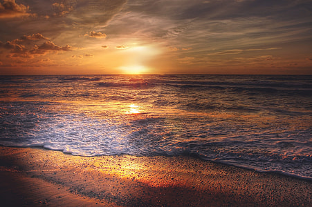 sunset scenery on body of water thumbnail
