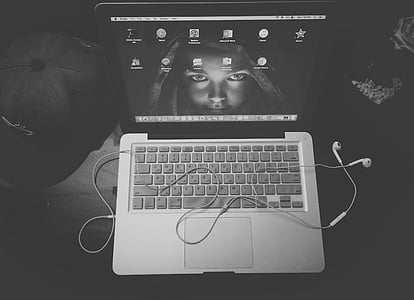 aerial and grayscale photography of MacBook Pro with turned-on screen thumbnail