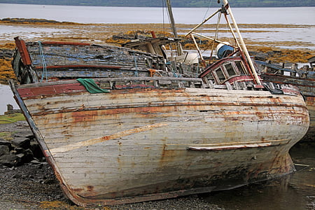 rusted white boat on land thumbnail