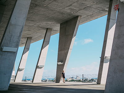 man lean on concrete building post thumbnail