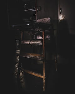 Baby's Wooden Highchair in Dim Light thumbnail
