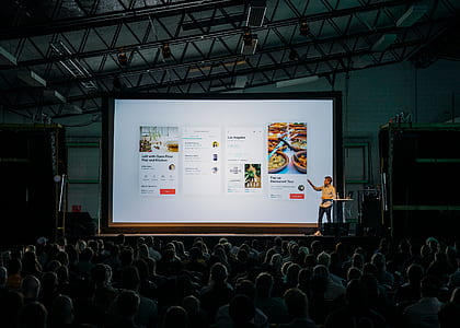 man presenting on stage thumbnail