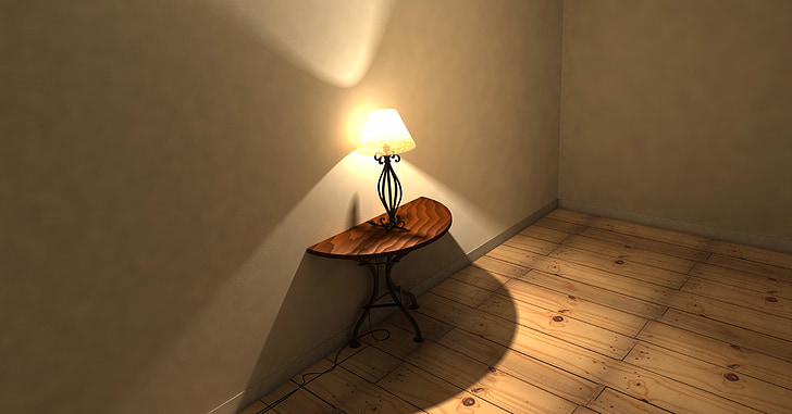 lighted table lamp on half moon table inside room