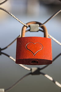 bokeh shot of orange and brown heart-printed padlock thumbnail