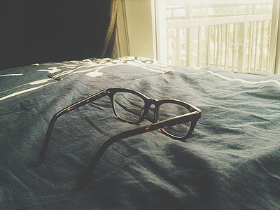 black framed eyeglasses on gray textile thumbnail
