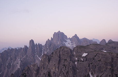 gray mountain under cloudy sky aerial photography thumbnail