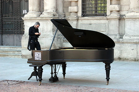 grand piano near building thumbnail
