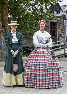 two women wearing traditional dresses thumbnail
