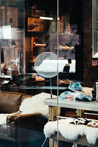 pair of teal-and-black slides on white rack thumbnail