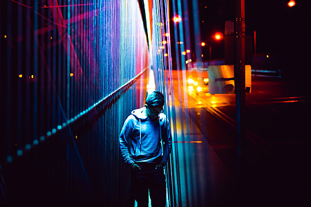 Man in city lights at night thumbnail