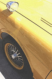 closeup photo of yellow car thumbnail