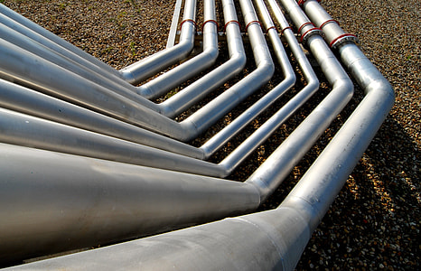 eight gray metal pipes on ground thumbnail