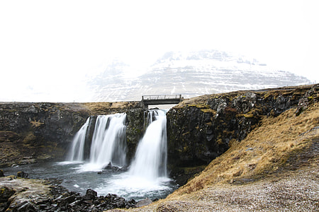 water flowing on dam under sky at daytime thumbnail