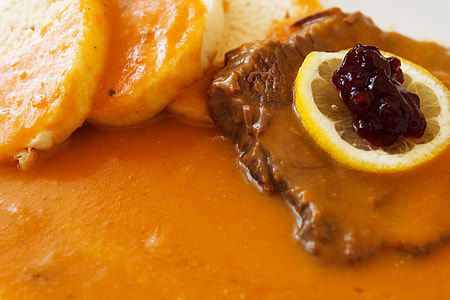 cooked meat with sliced lemon thumbnail