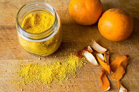 two orange fruits beside mason jar thumbnail
