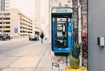pineapple fruit beside blue payphone thumbnail