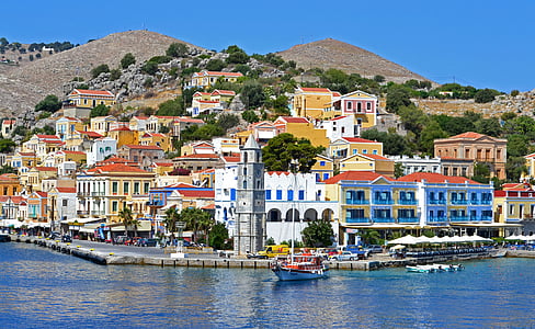 boat near pier with buildings thumbnail