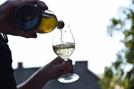 person pouring wine on glass thumbnail