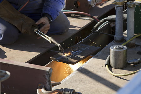 person holding black welding machine thumbnail