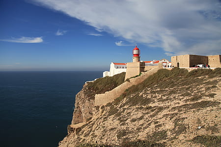 lighthouse near building thumbnail