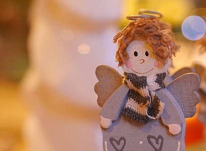 gray and brown angel wooden figurine thumbnail