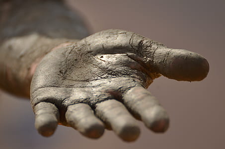 left human palm covered with soil thumbnail