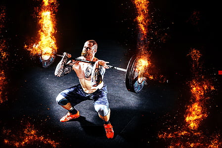 man carrying on fire barbel thumbnail
