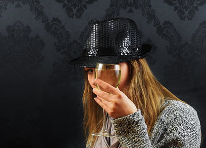 woman holding filled wine glass thumbnail