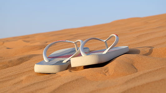 Pair of White Flip-flops on Focus Photo thumbnail