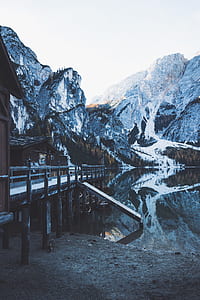 wooden dock surrounded by mountains thumbnail