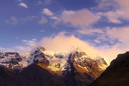 snow covered mountain under clouds thumbnail