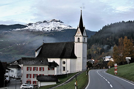 black and white painted church beside road thumbnail