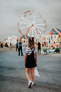 woman wearing whtie and black short-sleeved dress at daytime thumbnail