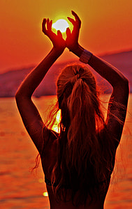 woman near body of water during sunset thumbnail
