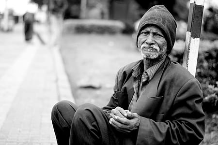 grayscale photo of man wearing black knit cap thumbnail