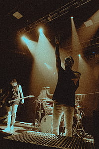 man singing near man playing guitar thumbnail