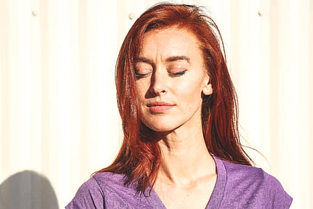 Close Up Photo of Woman Wearing Purple Top thumbnail