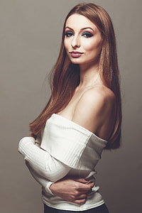 standing woman wearing white long-sleeved sweater thumbnail