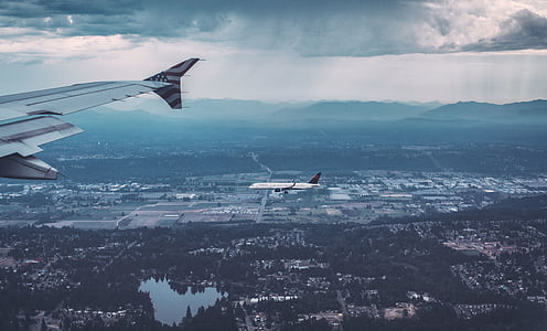 two airplanes up in the sky thumbnail